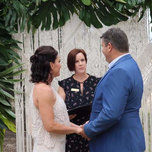 Couple signing the marriage register on the Gold Coast with their civil celebrant